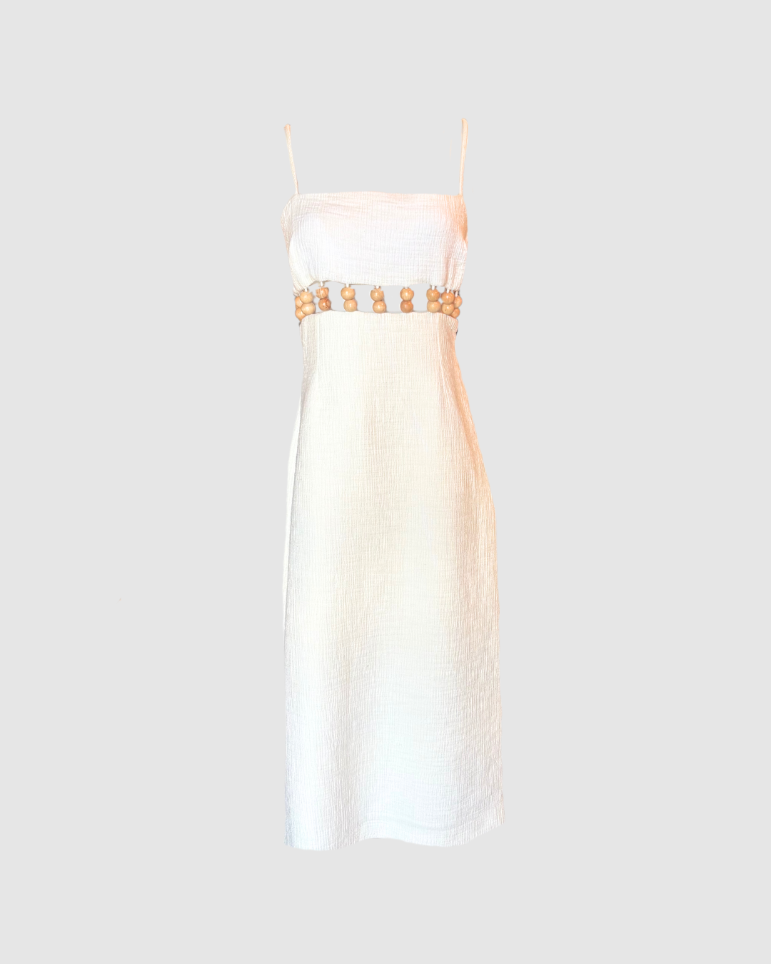 Vestido midi blanco con bolitas estilo madera