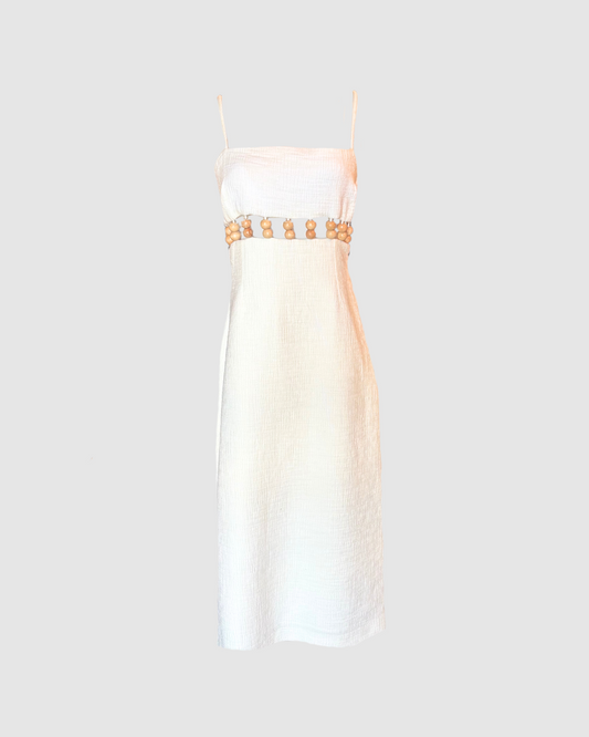 Vestido midi blanco con bolitas estilo madera